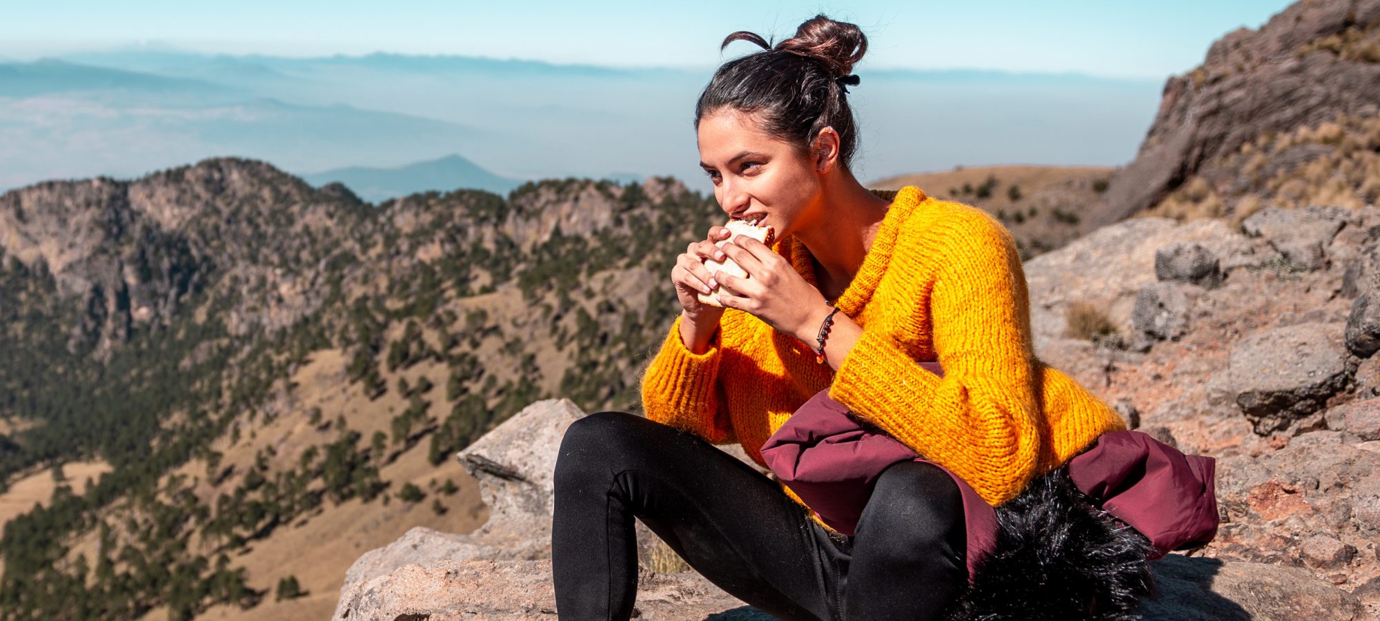 Woman eating lunch on hike