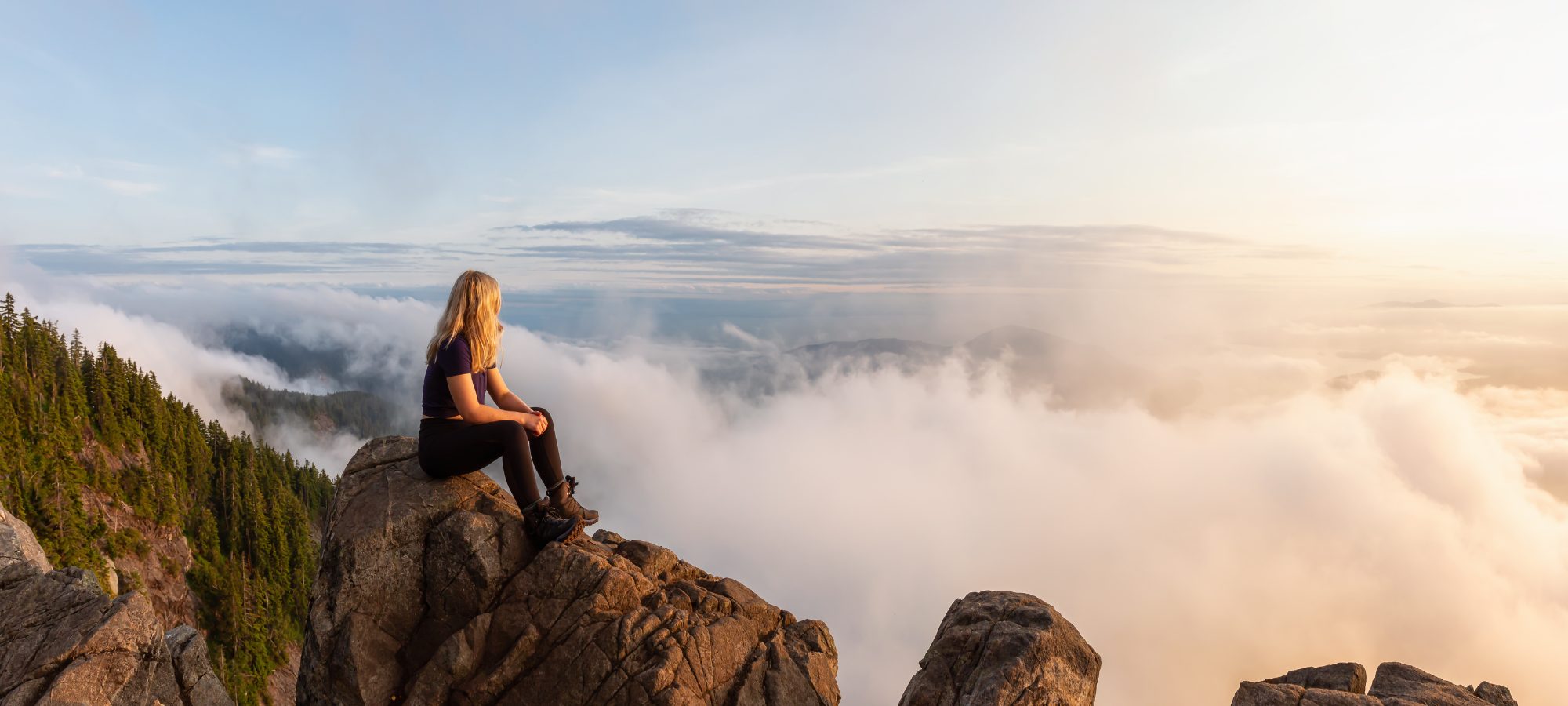 Ikigai. Woman sits on mountain