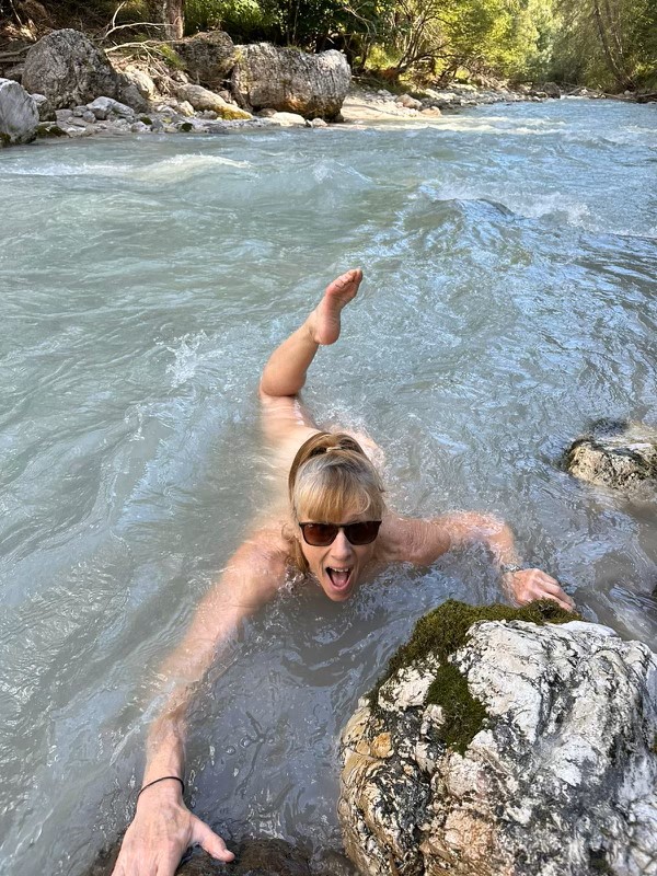 Di Westaway takes a cheeky dip in an icy river